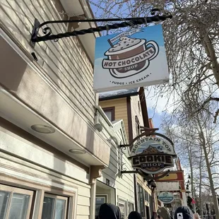 two people standing in front of a building