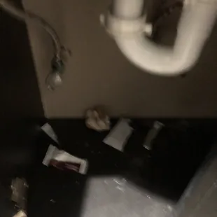 trash in the bathroom cabinet