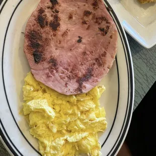 Side of ham and scrambled eggs