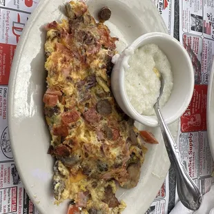 Mushroom omelette with sausage, bacon, ham, and cheese.