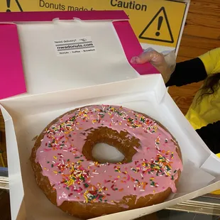 Handmade 9 inch donut with custom toppings.