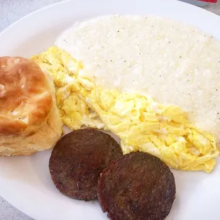 Breakfast plate with eggs, grits, sausage and biscuit--you get two biscuits