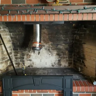 This large fireplace required a custom surround, which we fabricated.