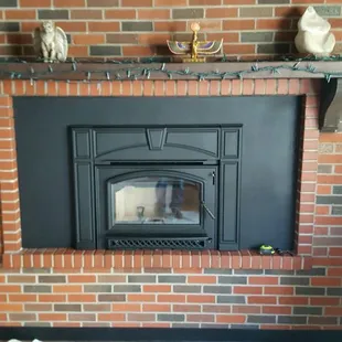 The finished product. A wood burning insert with custom surround.