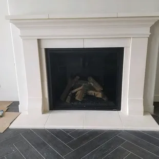 A beautiful gas fireplace and stone mantel professionally installed by Mountain West Sales.