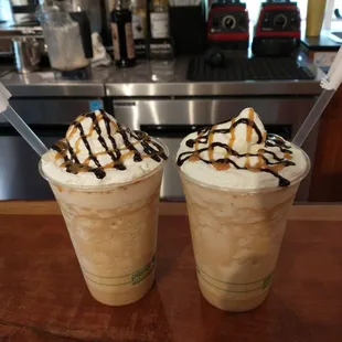 two iced coffees with caramel drizzle