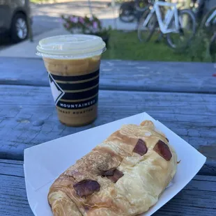 Bacon and Gouda croissant and iced café con leche