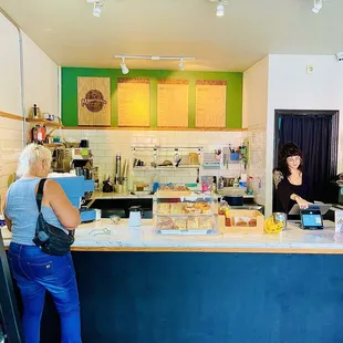 two women standing at the counter