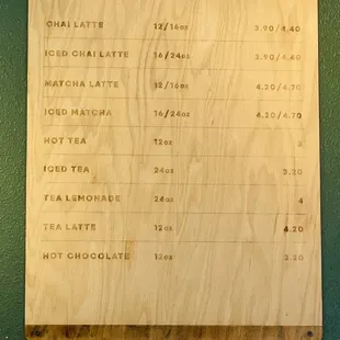 a menu on a wooden board