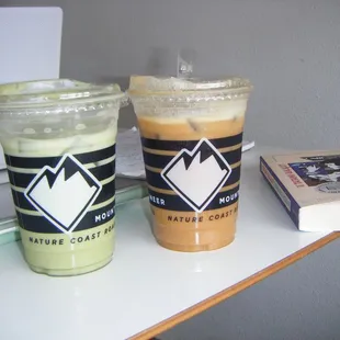 Both medium sized;  matcha latte and carmel cold brew with oatmilk