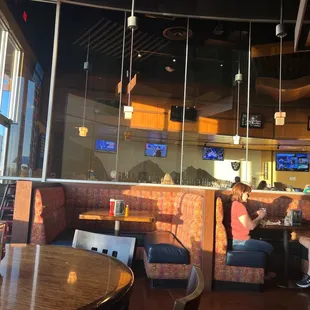 two people sitting at a table in a restaurant