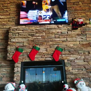 christmas stockings hung on a fireplace