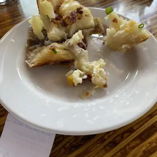 Embarrassing, undercooked, cold potato skins that have fallen apart.