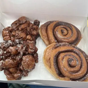 Apple fritters and cinnamon rolls. OMG, they're massive.