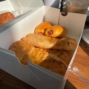 a box of pastries and a drink