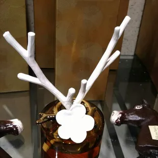 a glass vase with a mouse on it