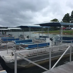 The pontoons available to rent... note the condition and the lawn chair used as the driver's seat.