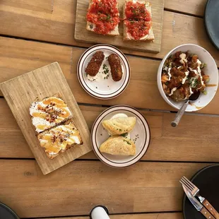 Tapas  Jamón croquetas, pan con tomate, hot honey tosta, patatas bravas