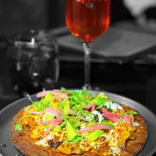 Mexican breakfast pizza and pomegranate mimosa | ig: whaEVAeats