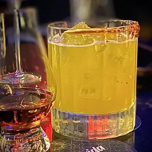 Shot of house mezcal and a tequila cocktail.