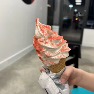 Vanilla soft serve with strawberry magic dust