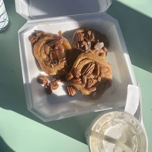 a takeout box of cinnamon buns