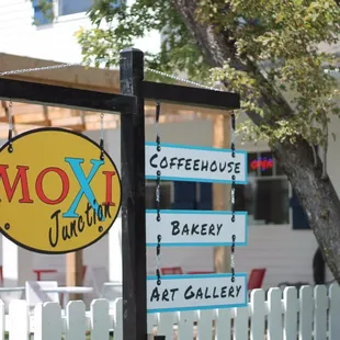 a sign in front of a restaurant