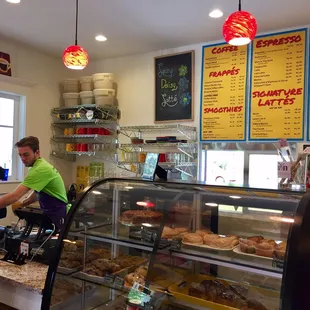 a man and a woman working at a bakery