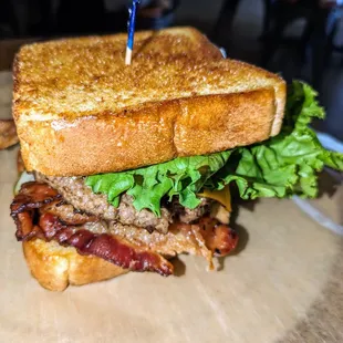 The Entrepreneur - 
 Build your own burger w/ two burger patties, American cheese, bacon, and lettuce on Texas Toast