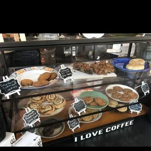 a display case filled with cookies and pastries