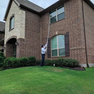Field experts use a 30-foot web pole on every visit to sweep the eaves and windows of your home, removing spider webs and wasp nests.