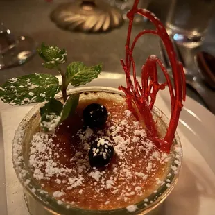 a dessert in a glass bowl on a plate