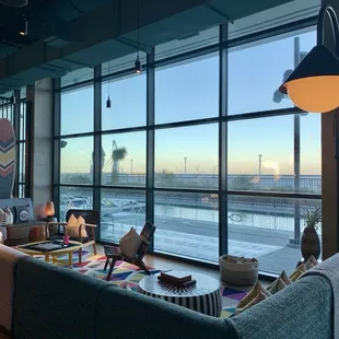 Seating area by the bar looking out to the pool and ocean