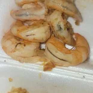 shrimp and rice in a styrofoam container