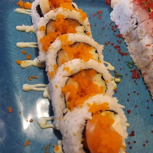 a sushi roll on a blue plate