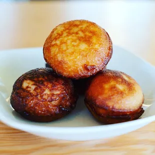 three fried donuts on a plate