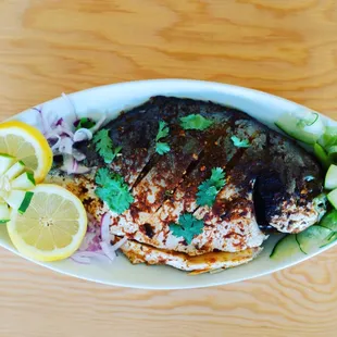 a plate of fish and vegetables