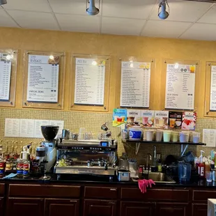 menus on the wall above the counter