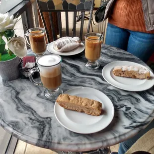 2 drip coffees, 1 cappuccino, 2 biscotti, 1 cream horn
