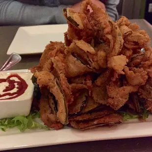 Fried pickle appetizer with spicy ranch.