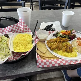 Greek Gyro, no tomato and no onion with yellow rice. Chicken Kabob with yellow rice, hummus, greek salad, tzatziki, pita!