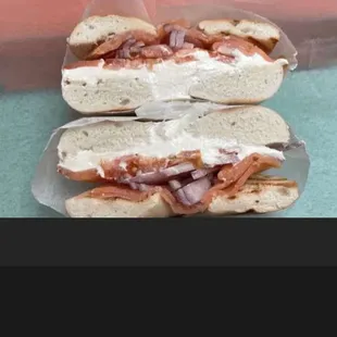 Bagel with cream cheese and smoke salmon tomato and red onion