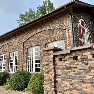 a brick building with arched windows