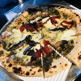 a pizza with several toppings on it