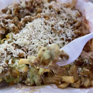 First bite of the pollo asado super fries....KILLER!! Tons of food as well as delicious!