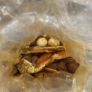 crab legs and eggs in a plastic bag
