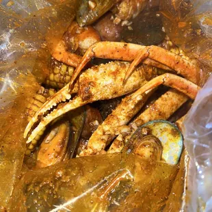 Snow crab, green mussels, head off shrimp, sausage with corn and potato