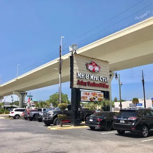cars parked in front of a restaurant