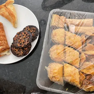 a tray of pastries and a plate of pastries