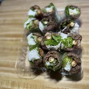 a plate of sushi rolls